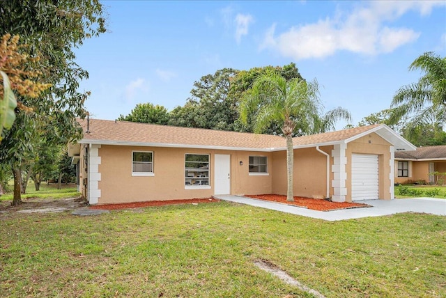 ranch-style home with concrete driveway, a front lawn, an attached garage, and stucco siding