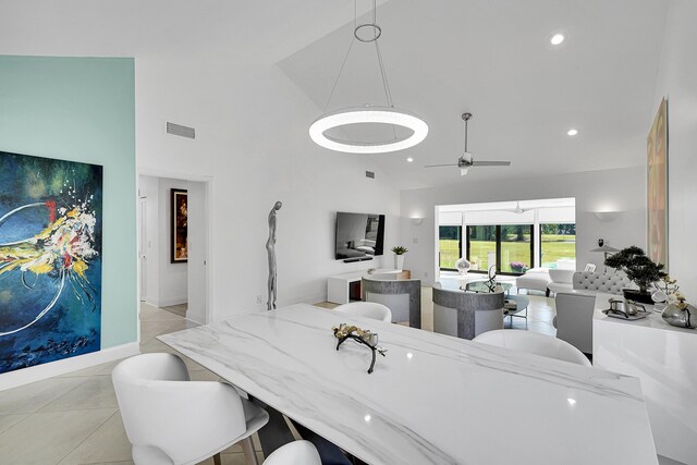 dining area with baseboards and light tile patterned floors