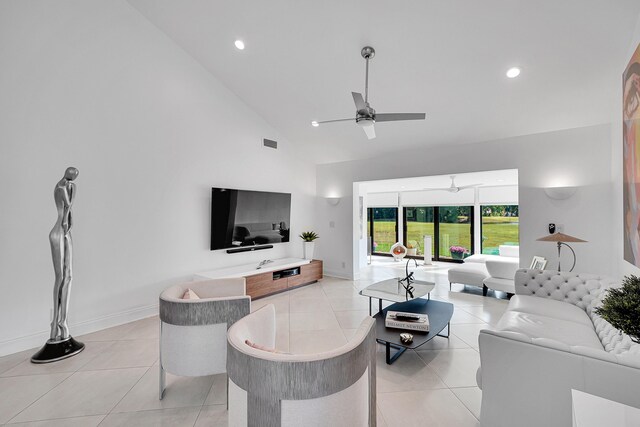 living area featuring light tile patterned floors, high vaulted ceiling, a ceiling fan, and recessed lighting