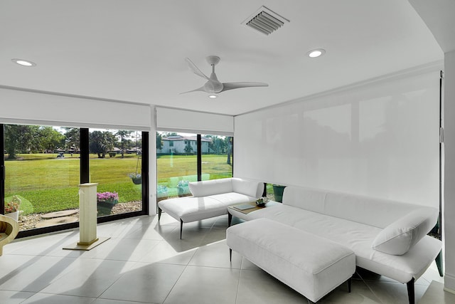 sunroom featuring visible vents and a ceiling fan