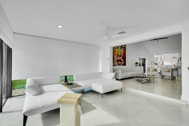 living area featuring lofted ceiling, recessed lighting, visible vents, a ceiling fan, and light tile patterned flooring