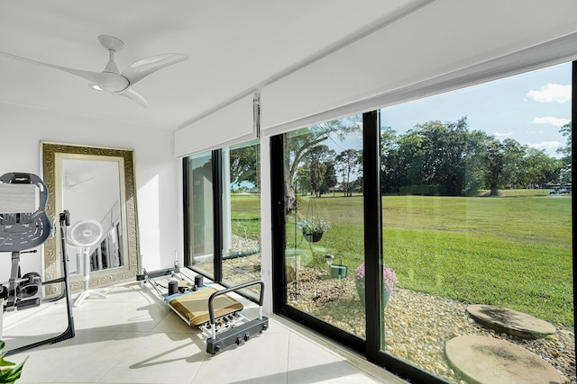 sunroom with a ceiling fan