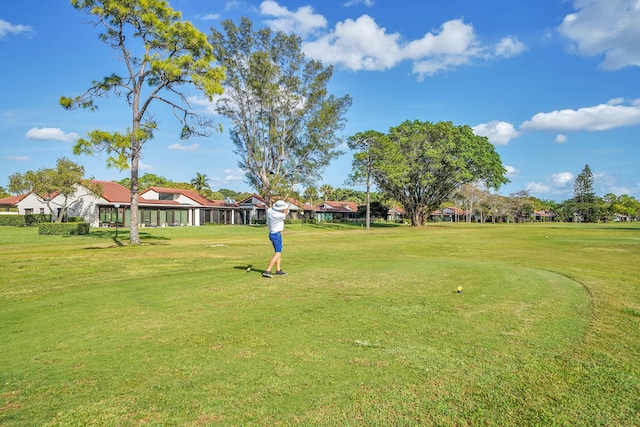 view of home's community featuring a lawn