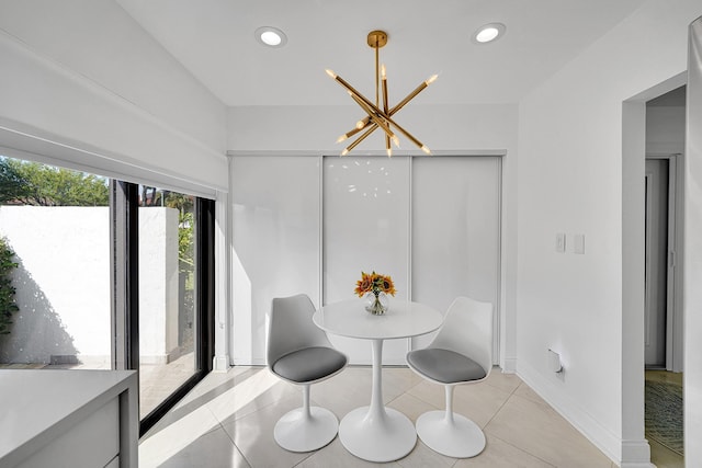 dining area with recessed lighting, light tile patterned floors, and an inviting chandelier