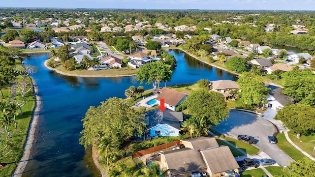 aerial view with a residential view and a water view