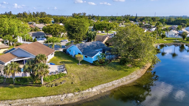 drone / aerial view featuring a water view and a residential view