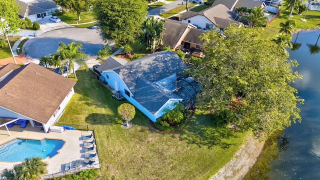 birds eye view of property with a water view and a residential view