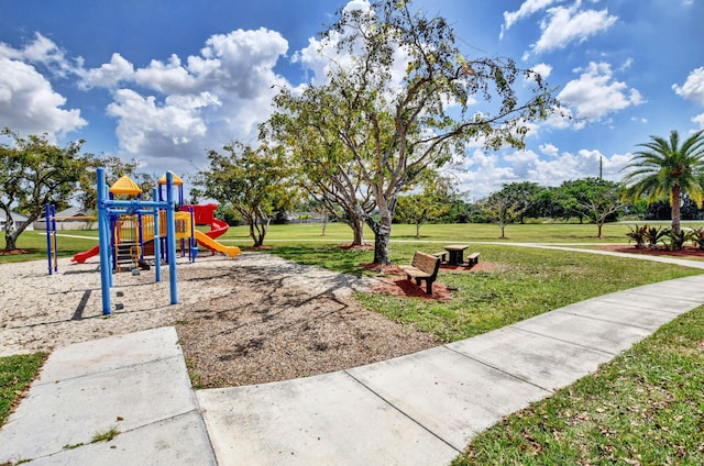 community jungle gym with a lawn