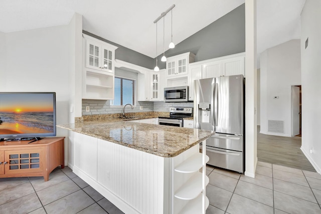 kitchen featuring open shelves, visible vents, appliances with stainless steel finishes, a sink, and a peninsula