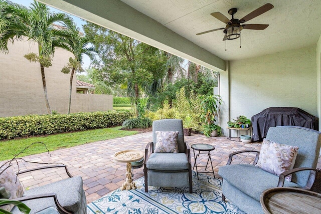 view of patio / terrace with a grill and a ceiling fan