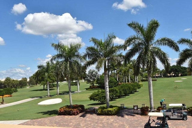 view of property's community with a lawn