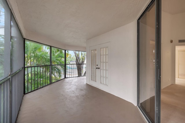 unfurnished sunroom featuring french doors and visible vents