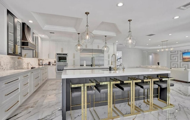 kitchen featuring recessed lighting, marble finish floor, appliances with stainless steel finishes, backsplash, and crown molding