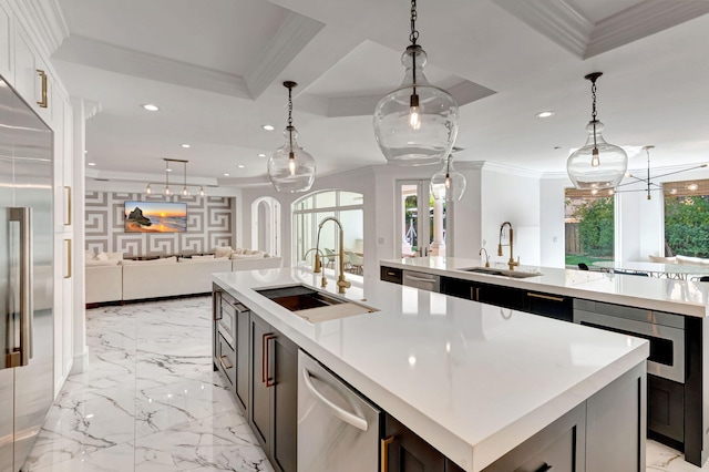 kitchen with a sink, a spacious island, and crown molding