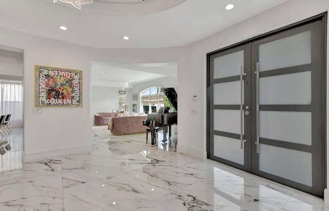 entryway featuring marble finish floor, recessed lighting, baseboards, and french doors