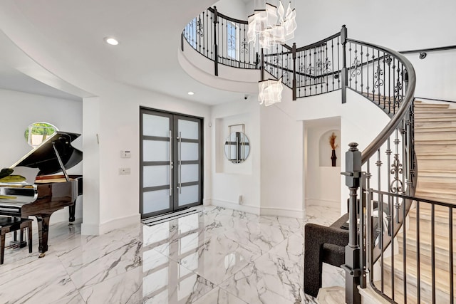 entryway featuring recessed lighting, baseboards, marble finish floor, french doors, and stairway