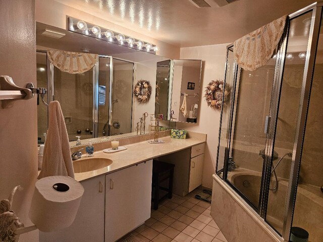 full bath with tile patterned flooring, enclosed tub / shower combo, and vanity