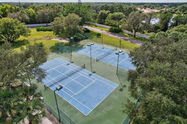 view of tennis court with fence