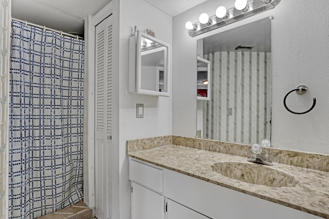 154 Weybridge Cir Unit C, Royal Palm Beach, FL 33411 - full bathroom featuring a closet, vanity, and a shower with curtain