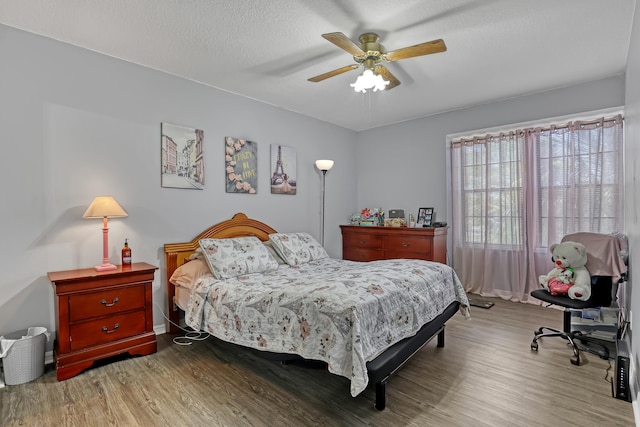 154 Weybridge Cir Unit C, Royal Palm Beach, FL 33411 - bedroom with a ceiling fan, wood finished floors, and a textured ceiling