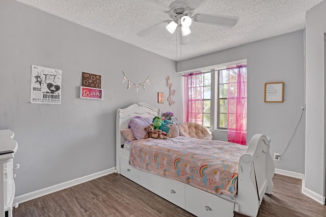 154 Weybridge Cir Unit C, Royal Palm Beach, FL 33411 - bedroom featuring baseboards, a textured ceiling, wood finished floors, and a ceiling fan