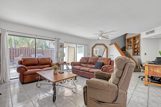 154 Weybridge Cir Unit C, Royal Palm Beach, FL 33411 - living room featuring light tile patterned flooring, stairs, a textured ceiling, visible vents, and ceiling fan