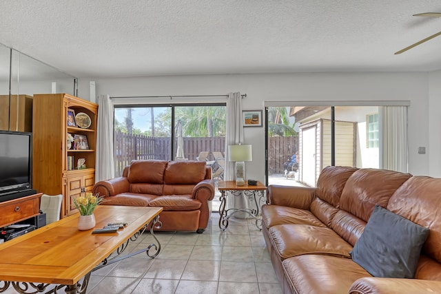 154 Weybridge Cir Unit C, Royal Palm Beach, FL 33411 - living area with a textured ceiling, ceiling fan, and light tile patterned floors
