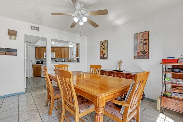 154 Weybridge Cir Unit C, Royal Palm Beach, FL 33411 - dining area featuring a textured ceiling, visible vents, light tile patterned floors, and a ceiling fan