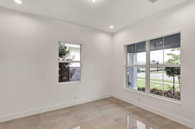 10033 Driftwood Way, Palm Beach Gardens, FL 33412 - empty room with plenty of natural light, baseboards, and recessed lighting
