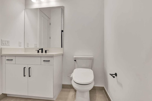 10033 Driftwood Way, Palm Beach Gardens, FL 33412 - bathroom with vanity, toilet, and baseboards