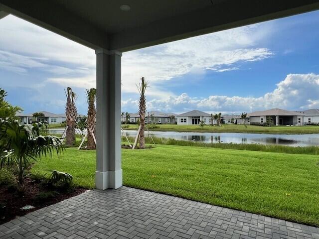 exterior space with a residential view and a water view