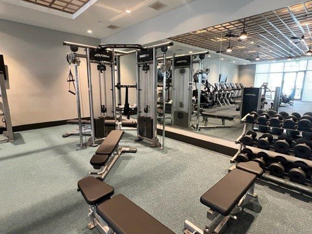 workout area with visible vents and baseboards