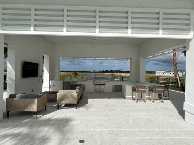 view of patio / terrace featuring fence and an outdoor living space