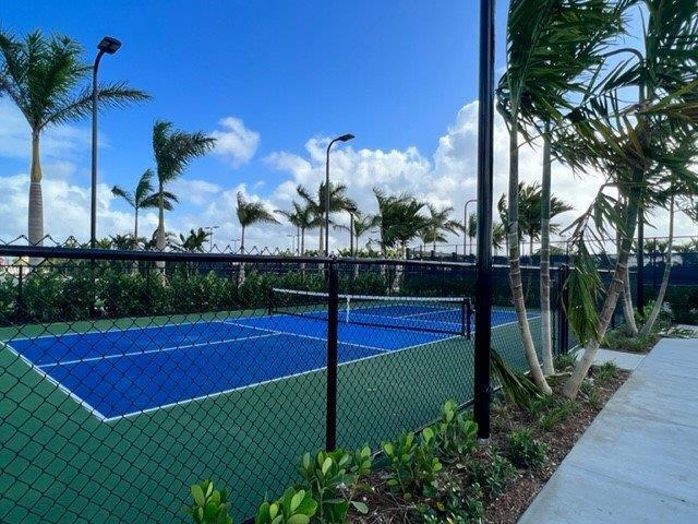 view of tennis court with fence