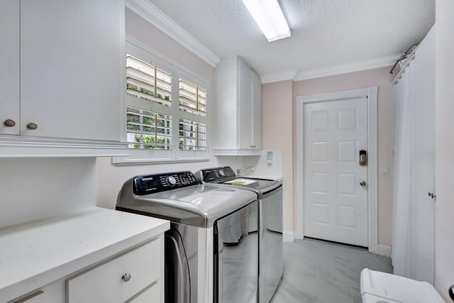 clothes washing area with marble finish floor, crown molding, cabinet space, a textured ceiling, and independent washer and dryer