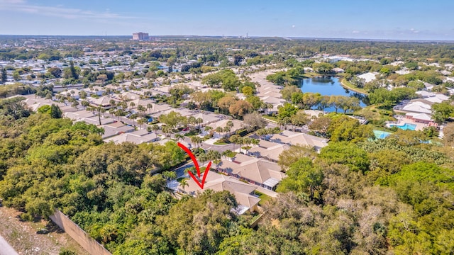 birds eye view of property featuring a residential view and a water view