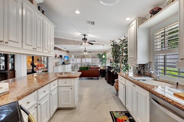 4047 Grove Point Rd, Palm Beach Gardens, FL 33410 - kitchen with stainless steel dishwasher, ceiling fan, a sink, white cabinets, and recessed lighting