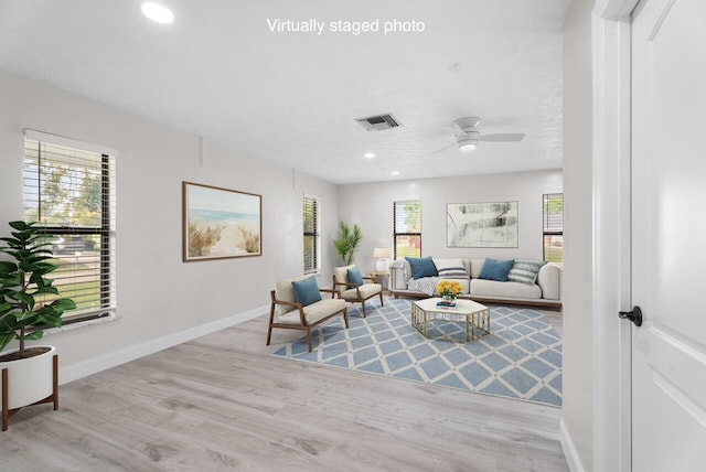 living room with visible vents, ceiling fan, baseboards, recessed lighting, and wood finished floors