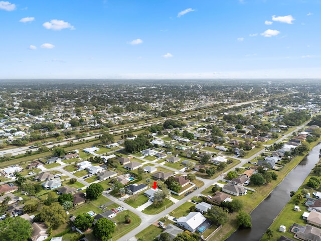 361 SW Carter Ave, Port Saint Lucie, FL 34983 - aerial view of property and surrounding area featuring nearby suburban area