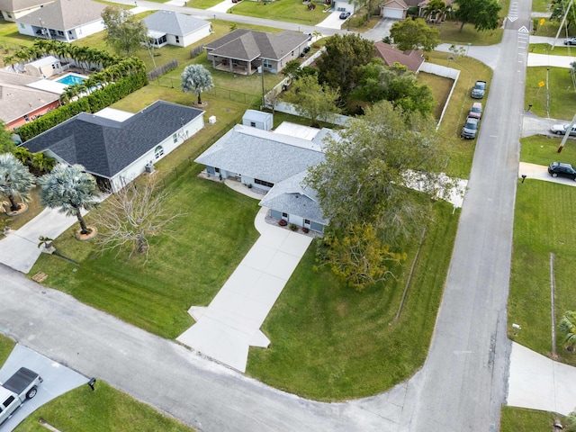 birds eye view of property with a residential view