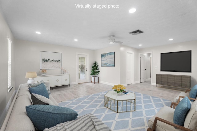 361 SW Carter Ave, Port Saint Lucie, FL 34983 - living room with wood finished floors, baseboards, a ceiling fan, recessed lighting, and plenty of natural light
