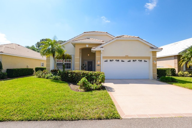 view of front of house featuring an attached garage, a tile roof, driveway, stucco siding, and a front yard