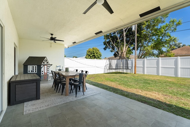 view of patio with outdoor dining area, a ceiling fan, and a fenced backyard