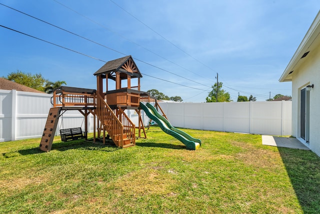 view of play area featuring a fenced backyard and a lawn