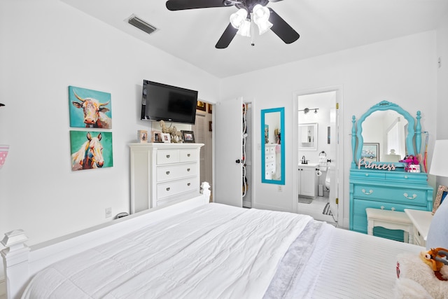 bedroom with connected bathroom, visible vents, and a ceiling fan