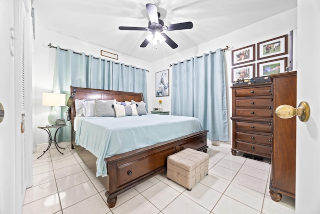 bedroom featuring light tile patterned floors and a ceiling fan