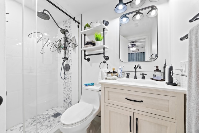 bathroom featuring visible vents, a stall shower, vanity, and toilet