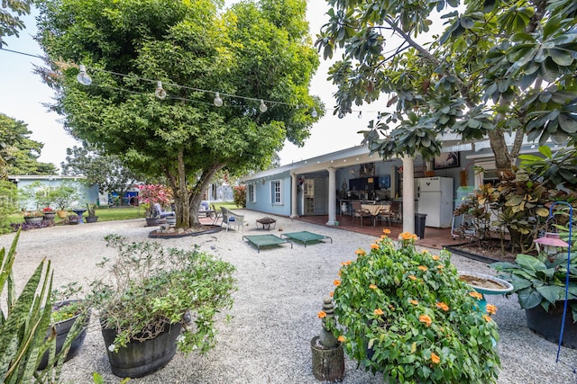 rear view of property featuring a patio