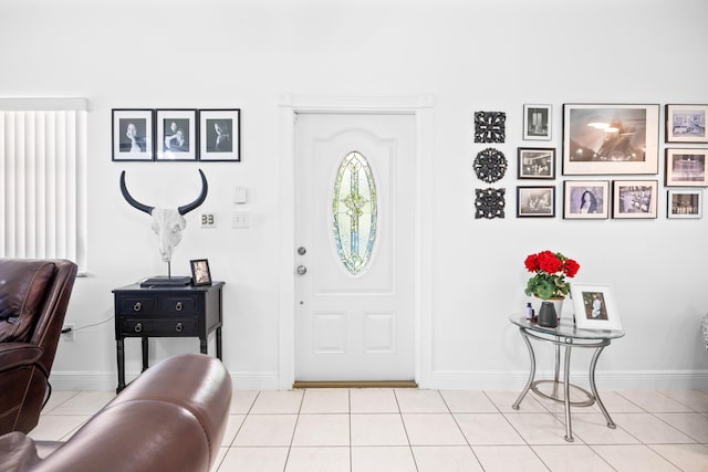 tiled entryway with baseboards