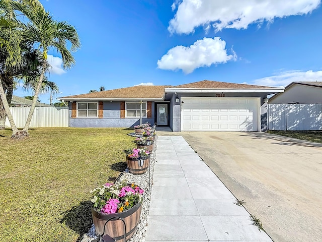 ranch-style house with driveway, a garage, fence, a front lawn, and stucco siding